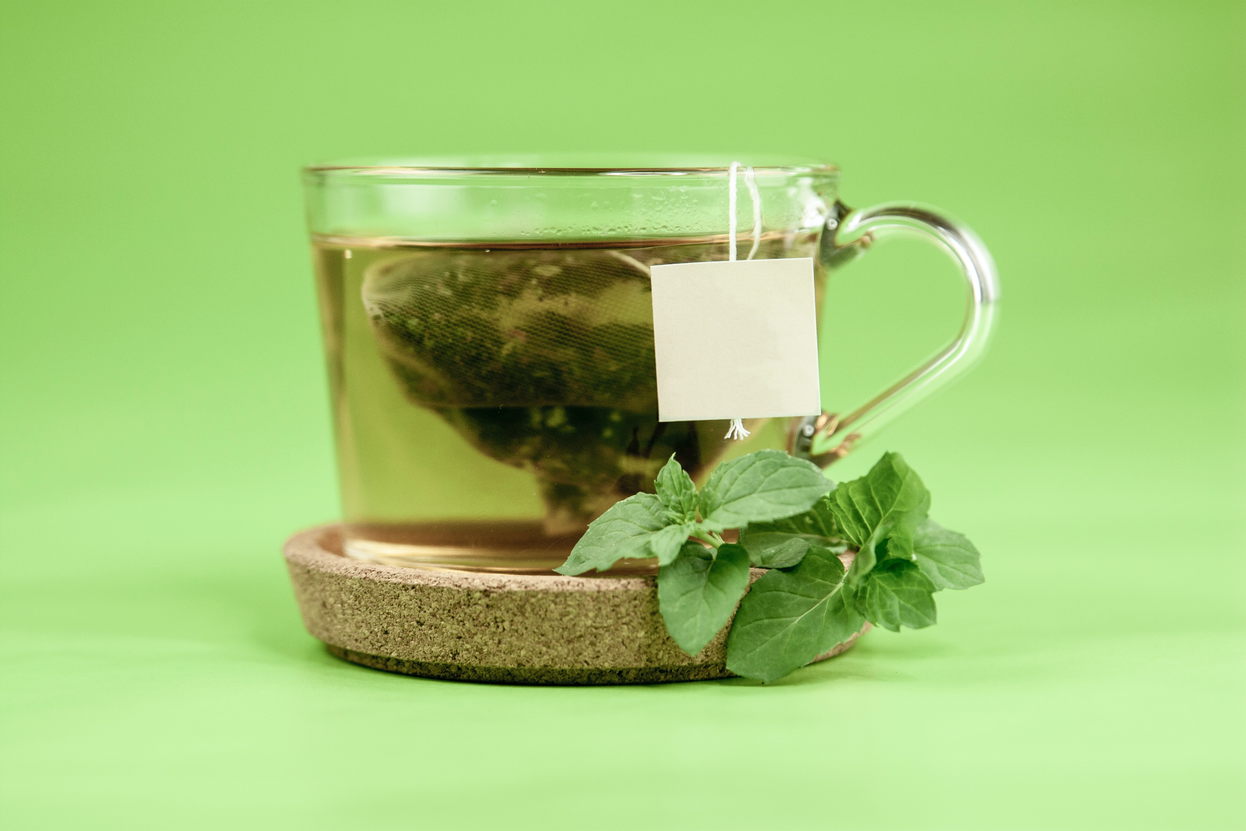 Jasmine tea brewing in a glass cup